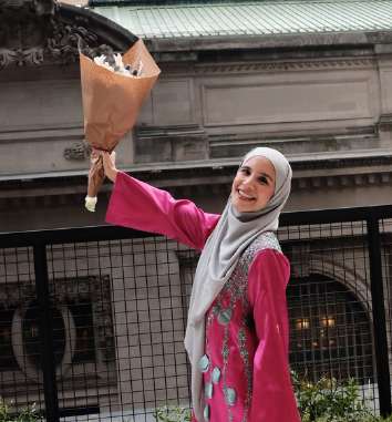 Zafira celebrating the journey in New York with a bouquet